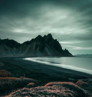 Moody beach and cliffs